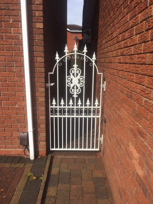 Premier metal gate fitted to entrance of a garden