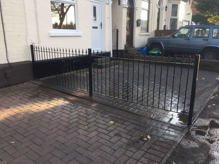Saxon wrought iron fencing in Birmingham installed to separate parking spaces