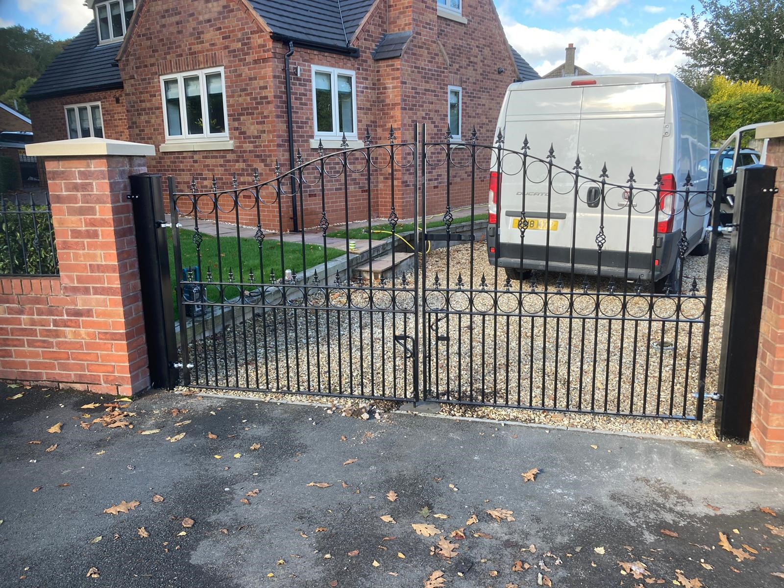 Arched wrought iron type estate gates