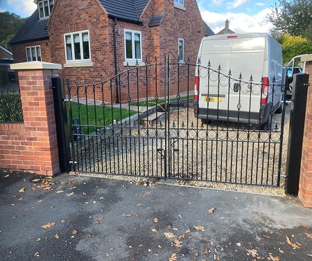 Arched metal gates with spear top finials